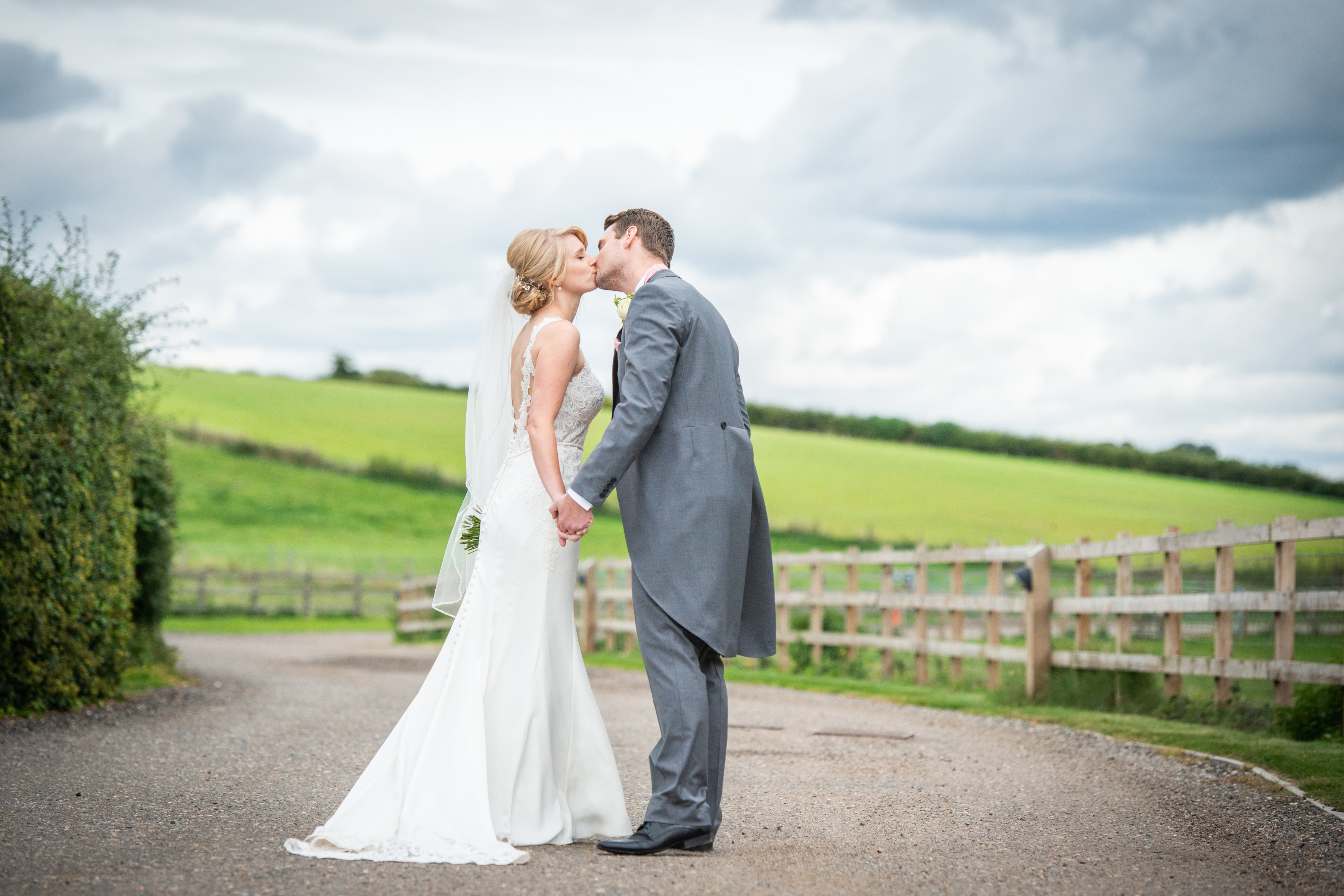 bride and groom kiss