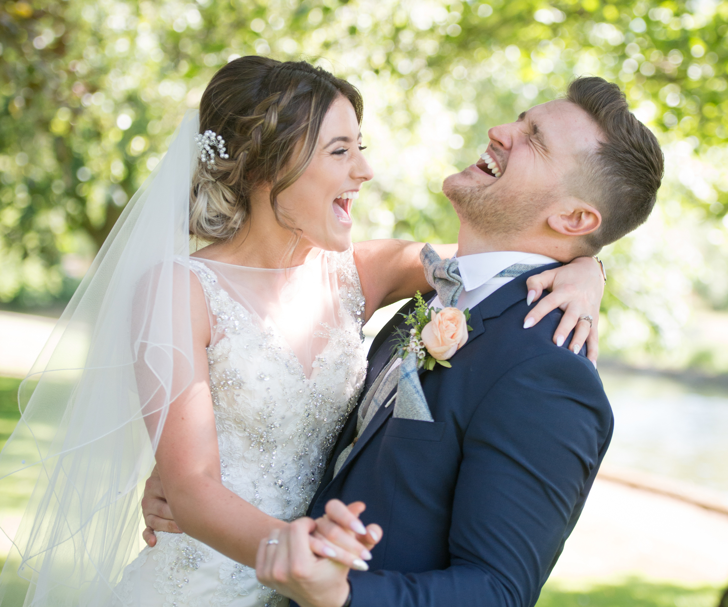 bride and groom laughing